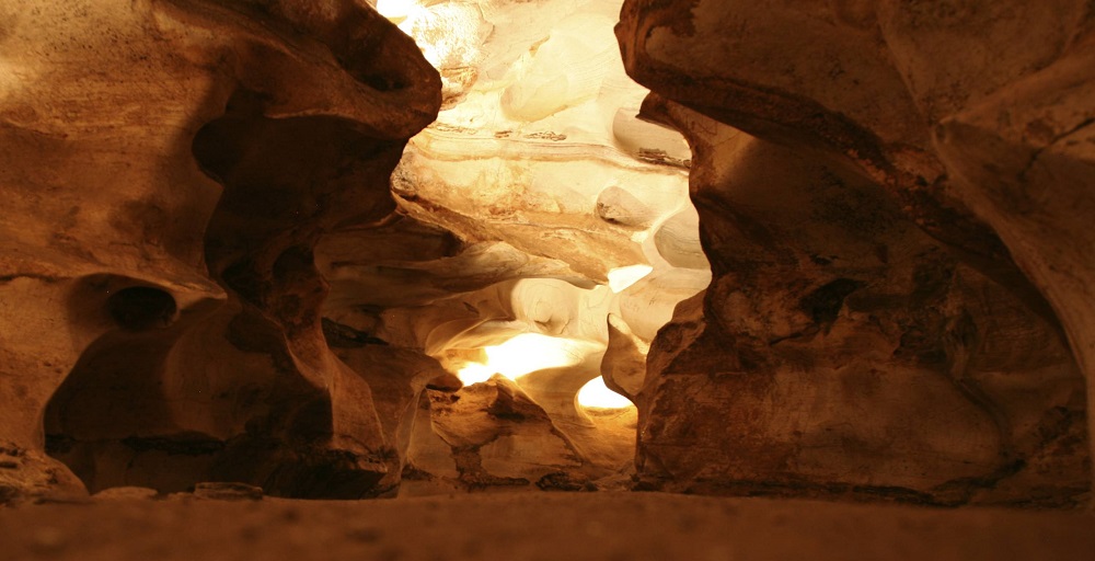 Inside of cave showing impressive rock formations.