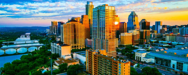 The city of austin shines as the sun comes up over downtown
