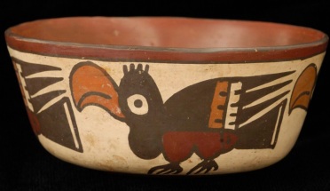 a peruvian artifact with a bird painted on it