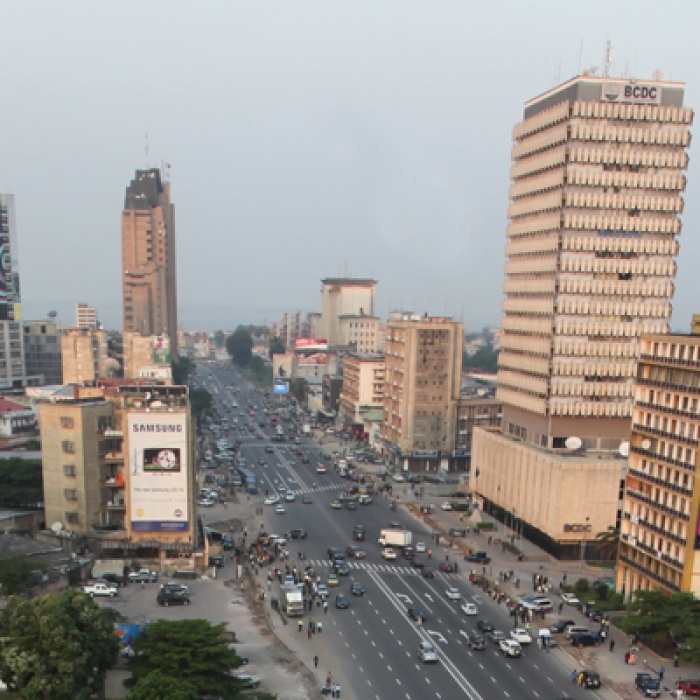City buildings in Democratic Republic of Congo with cars on road