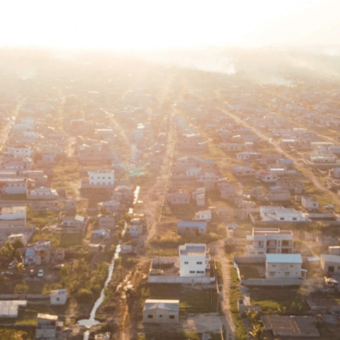 Flat city in Mozambique with houses and bright sun