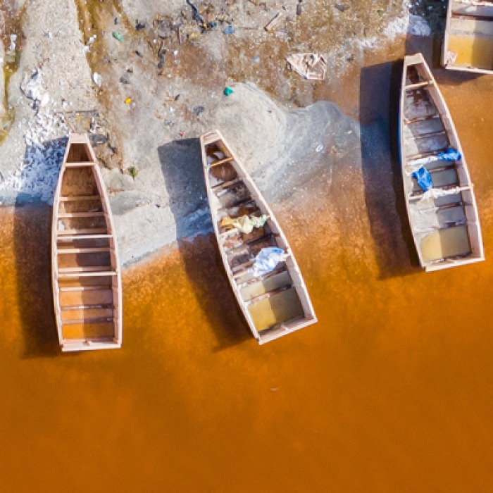 Row of boats washed up on shore in Senegal