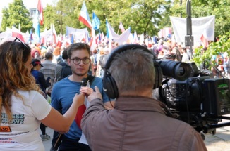UT Polish Club president Nathan Silverstein interviews with Polish TV crew
